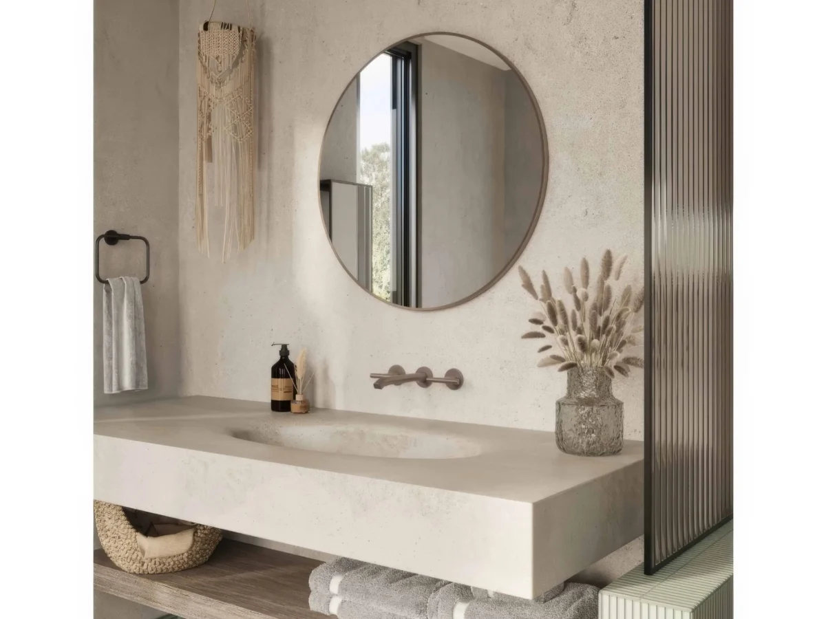 Round bathroom mirror in a modern minimalist bathroom exported by QuickExim.