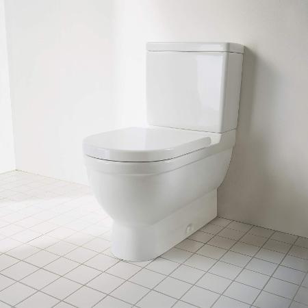 Modern white floor-standing toilet in a residential bathroom