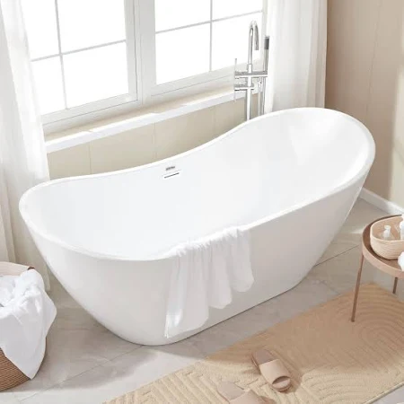 Modern freestanding bathtub in a sunlit bathroom exported by QuickExim.