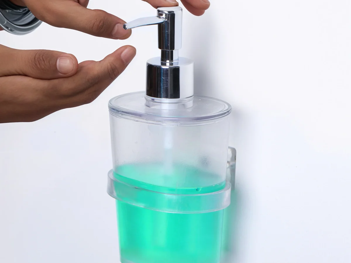 Wall-mounted soap dispenser with chrome pump exported by QuickExim.